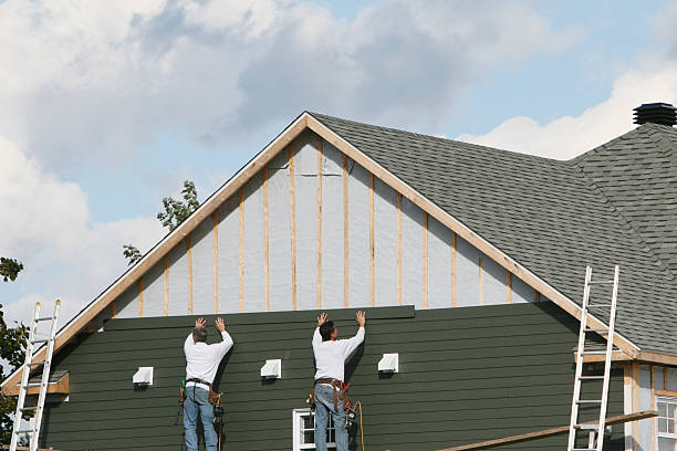 Professional Siding Installation technician working in Troy, NY